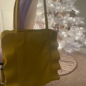 yellow shoulder bag with side ruffles